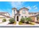 Charming two-story stucco home with a well-maintained front yard and desert landscaping at 5854 Willow Trace Ave, Las Vegas, NV 89139