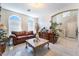 Spacious living room featuring tile floors, archway, and staircase in view at 5854 Willow Trace Ave, Las Vegas, NV 89139