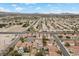 A high-angle captures a residential neighborhood with pools and desert landscaping at 5937 Round Castle St, Las Vegas, NV 89130
