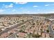 Breathtaking aerial view of a suburban neighborhood featuring tree-lined streets and a variety of single-Gathering homes at 5937 Round Castle St, Las Vegas, NV 89130