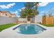 Image of a sparkling pool and palm tree with an outdoor structure in the backyard at 5937 Round Castle St, Las Vegas, NV 89130
