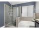 Modern bath featuring glass shower, soaking tub, and glass bowl sinks at 5937 Round Castle St, Las Vegas, NV 89130
