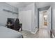 Bedroom with wood-look flooring, closet, work desk, and natural light at 5937 Round Castle St, Las Vegas, NV 89130