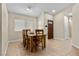 Inviting dining area featuring a wooden table set near the home's front door at 5937 Round Castle St, Las Vegas, NV 89130