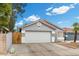 Single-story home with a large two car garage with well maintained landscaping at 5937 Round Castle St, Las Vegas, NV 89130