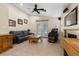 Bright living room with vaulted ceilings, fireplace, and access to the backyard through glass doors at 5937 Round Castle St, Las Vegas, NV 89130