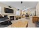Open-concept living area featuring a fireplace, kitchen, and tile flooring throughout at 5937 Round Castle St, Las Vegas, NV 89130