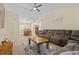 Cozy living room with a ceiling fan, connected to dining area, offering a great space at 5937 Round Castle St, Las Vegas, NV 89130