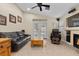 Bright living room with vaulted ceilings, fireplace, and access to the backyard through glass doors at 5937 Round Castle St, Las Vegas, NV 89130