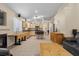 Open-concept living area featuring a fireplace, kitchen, and tile flooring throughout at 5937 Round Castle St, Las Vegas, NV 89130