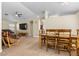 The Living room is spacious with natural light and has a wooden table set that connects to the kitchen at 5937 Round Castle St, Las Vegas, NV 89130