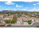 Charming neighborhood with well-maintained homes, mature trees, and stunning mountain views in the distance at 5937 Round Castle St, Las Vegas, NV 89130