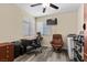 Cozy office space with a desk, rolling chair, reading chair and window for natural light at 5937 Round Castle St, Las Vegas, NV 89130