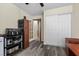 This office space has a storage cabinet, white closet doors, and luxury vinyl plank flooring at 5937 Round Castle St, Las Vegas, NV 89130