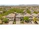 Aerial view highlighting homes with solar panels, landscaping, and a well-planned neighborhood layout at 6049 Paddleboat St, North Las Vegas, NV 89031