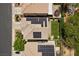 Aerial view showing solar panels on the home's roof and well-maintained landscaping in the backyard at 6049 Paddleboat St, North Las Vegas, NV 89031