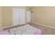 Neutral bedroom featuring carpeted floors and a closet, offering a cozy and functional space at 6049 Paddleboat St, North Las Vegas, NV 89031