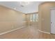 Neutral bonus room with light wood floors, bright windows, and recessed lighting at 6049 Paddleboat St, North Las Vegas, NV 89031