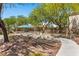 Scenic view of community park with walking paths, playground, picnic area, and green landscaping at 6049 Paddleboat St, North Las Vegas, NV 89031