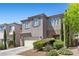 Charming two-story home with desert landscaping in front yard at 6049 Paddleboat St, North Las Vegas, NV 89031