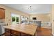 Open-concept kitchen and dining area offers modern lighting and seamless transition to the living space at 6049 Paddleboat St, North Las Vegas, NV 89031