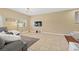 View of the living room with TV and staircase to second floor at 6049 Paddleboat St, North Las Vegas, NV 89031