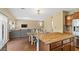 View of the open floor plan showcases the kitchen, dining, and living areas at 6049 Paddleboat St, North Las Vegas, NV 89031