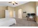 A spacious main bedroom features plush carpeting and includes a dedicated workspace at 6049 Paddleboat St, North Las Vegas, NV 89031