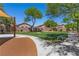 Community park with walking paths, benches, and grassy areas, offering a relaxing outdoor space at 6049 Paddleboat St, North Las Vegas, NV 89031