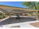 Open-air pavilion with picnic tables, providing shade and seating near the playground area at 6049 Paddleboat St, North Las Vegas, NV 89031