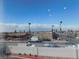 Balcony view showcases neighborhood landscape with palm trees lining the street at 6201 E Lake Mead Blvd # 218, Las Vegas, NV 89156