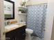 Bathroom featuring granite countertop and decorative shower curtain at 6201 E Lake Mead Blvd # 218, Las Vegas, NV 89156