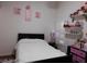 Bedroom with a bed and shelves with toys at 6201 E Lake Mead Blvd # 218, Las Vegas, NV 89156