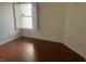 Bedroom with hardwood floors, plantation shutters, and light-filled space at 6201 E Lake Mead Blvd # 218, Las Vegas, NV 89156