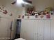Bright bedroom featuring white closet doors and cute butterfly decorations at 6201 E Lake Mead Blvd # 218, Las Vegas, NV 89156