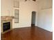 Living room featuring a fireplace and hardwood floors at 6201 E Lake Mead Blvd # 218, Las Vegas, NV 89156