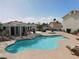 Community pool area includes a pool, spa, covered patio with chairs and tables and chaise lounges at 6201 E Lake Mead Blvd # 218, Las Vegas, NV 89156