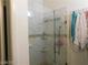 Bathroom shower featuring tiled walls and a glass door at 6201 E Lake Mead Blvd # 218, Las Vegas, NV 89156