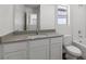 Clean bathroom with white cabinetry, quartz countertop, and tile flooring at 6233 Blood Lily Ave, Las Vegas, NV 89122