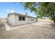 A low-maintenance backyard with a patio and gravel landscaping at 6244 Parsifal Pl, Las Vegas, NV 89107