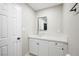 Bright bathroom featuring a glass vessel sink, white cabinets, and quartz countertop at 6244 Parsifal Pl, Las Vegas, NV 89107