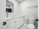 Contemporary bathroom features a glass bowl sink, modern faucet, and toilet at 6244 Parsifal Pl, Las Vegas, NV 89107