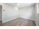 An empty bedroom features hardwood floors, recessed lighting, and fresh paint at 6244 Parsifal Pl, Las Vegas, NV 89107