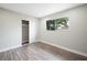 Bedroom with hardwood floors, closet and window at 6244 Parsifal Pl, Las Vegas, NV 89107