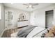 A modern bedroom with hardwood floors, a large closet, and minimalist decor at 6244 Parsifal Pl, Las Vegas, NV 89107