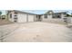 Front exterior with two-car garage and wide driveway at 6244 Parsifal Pl, Las Vegas, NV 89107