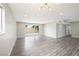 Bright living space with recessed lights, sliding glass doors for outdoor access, and wood-style flooring at 6244 Parsifal Pl, Las Vegas, NV 89107
