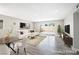 Bright and airy living room with modern furniture and sliding glass doors at 6244 Parsifal Pl, Las Vegas, NV 89107
