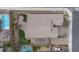 An aerial view of this property showcases a pool, putting green, and patio at 6985 Hopi Summit Ct, Las Vegas, NV 89149