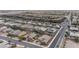 Expansive aerial view of a residential neighborhood featuring single-Gathering homes and desert landscaping at 6985 Hopi Summit Ct, Las Vegas, NV 89149